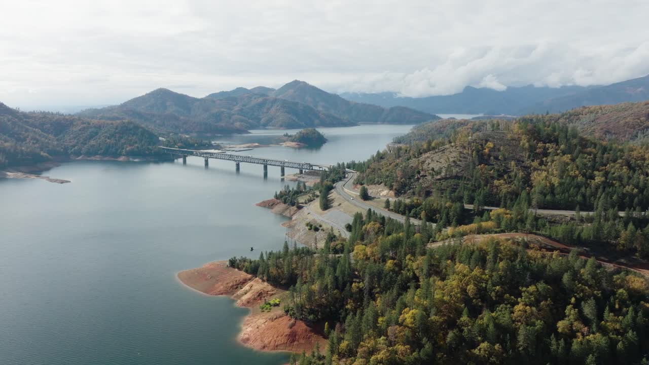 Aerial Footage Featuring Epic View of Northern California Forest and Reservoir Shasta Lake in Fall Time - Leaves Changing Colors in Autumn