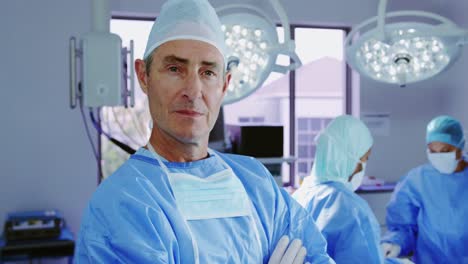 Close-up-of-mature-Caucasian-female-doctor-standing-with-arms-crossed-in-hospital