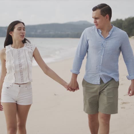 Resting-couple-spending-time-on-sea-beach