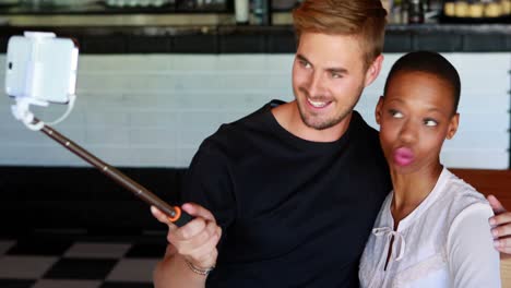 Happy-couple-taking-selfie-with-selfie-stick