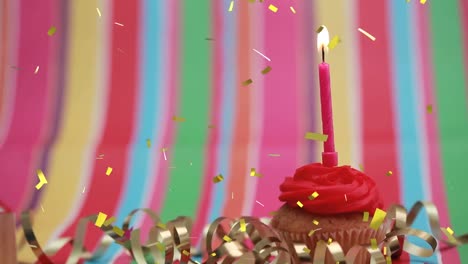 Animation-Von-Konfetti,-Das-über-Eine-Kerze-Auf-Einem-Geburtstagskuchen-Fällt