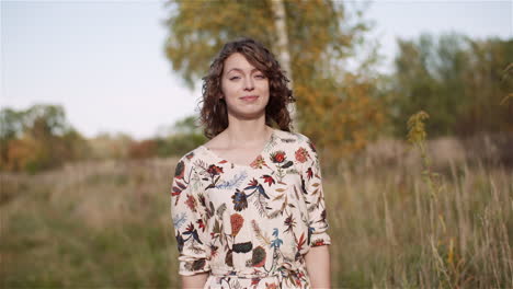 beautiful woman posing into camera and smile at golden sunset 13