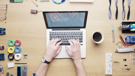 top view software engineer drinking coffee using laptop computer  at desk from above - red epic dragon