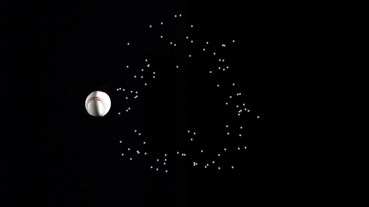 Baseball and particle explosion animation on black background