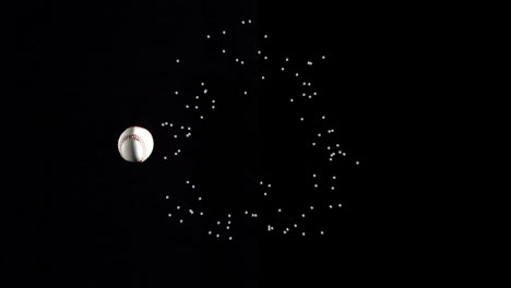 Baseball and particle explosion animation on black background