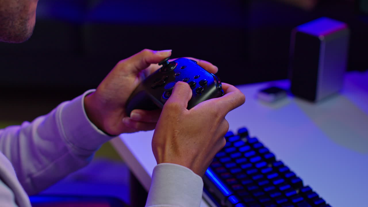 Man playing video games on a console with a controller
