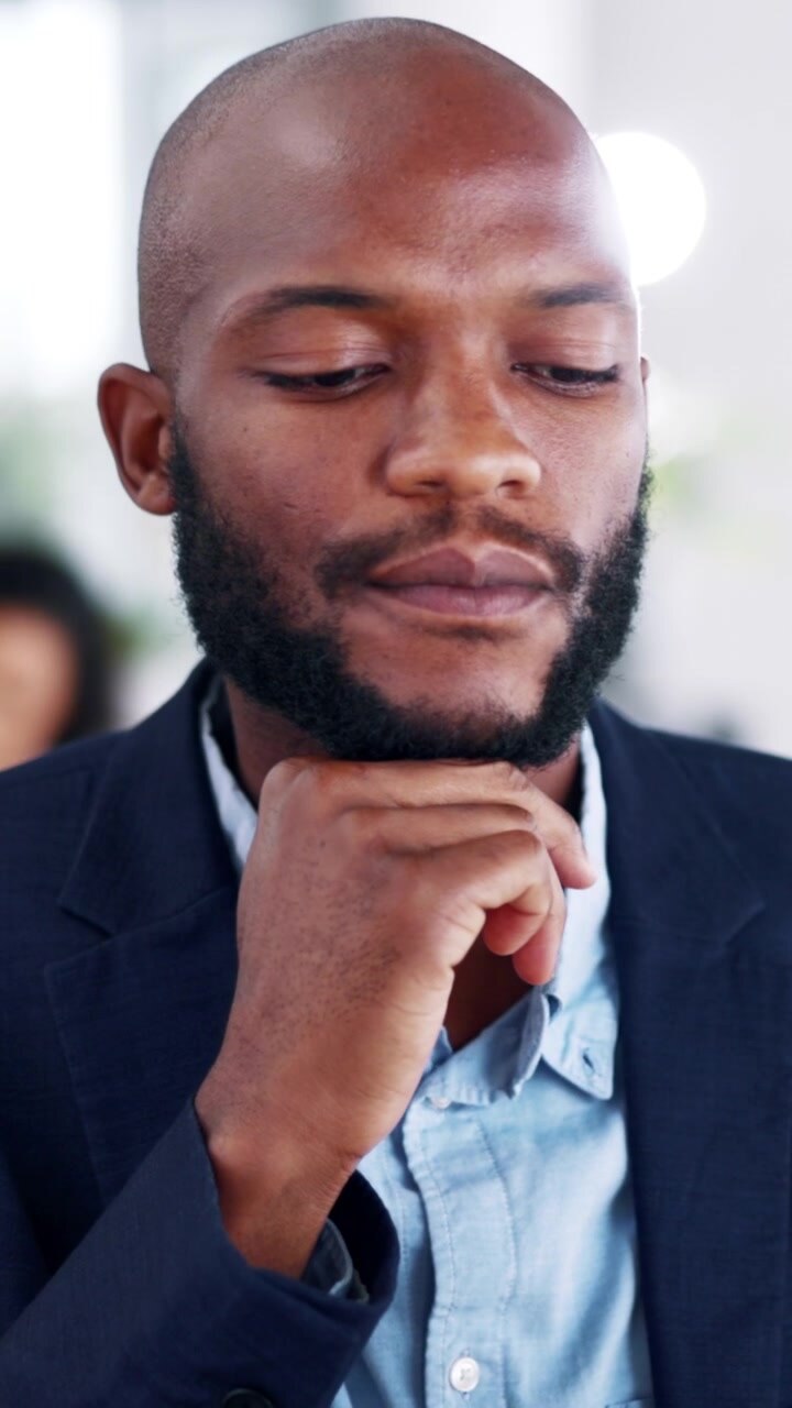 Thoughtful Businessman Thinking in Modern Office