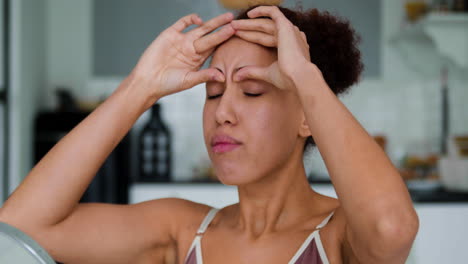 woman looking in the mirror