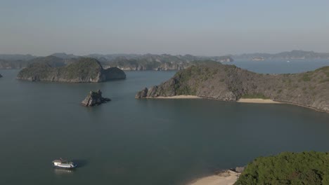 aerial pan: rugged islands of famous ha long bay in northern vietnam