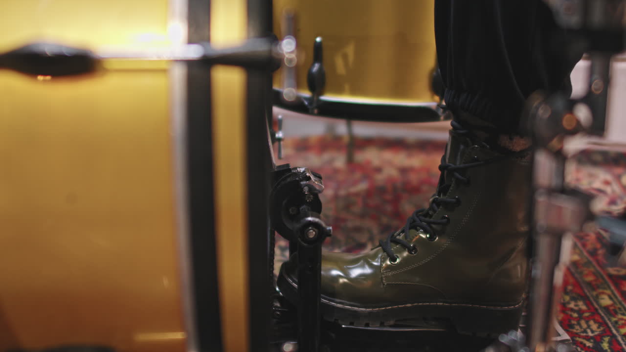 Leg Of Drummer Pressing Pedal While Playing