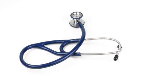 high angle of a stethoscope spinning against white