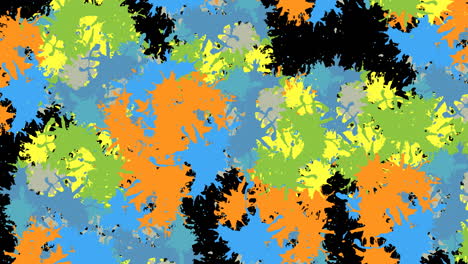 animation of multi coloured splashes of paint on black background