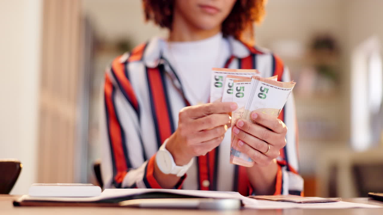 Woman counting 50 euro bills