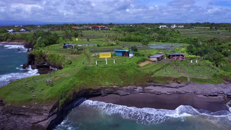 Idyllic-Nature-Scenery-In-The-Beach-Love,-Kediri,-Bali,-Indonesia---aerial-pullback