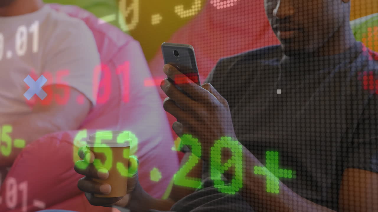 Man holding phone and drink with stock market data animation overlay