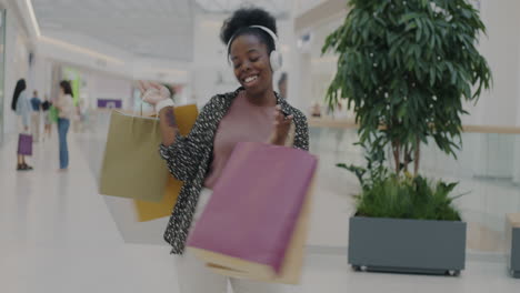 happy woman shopping at the mall