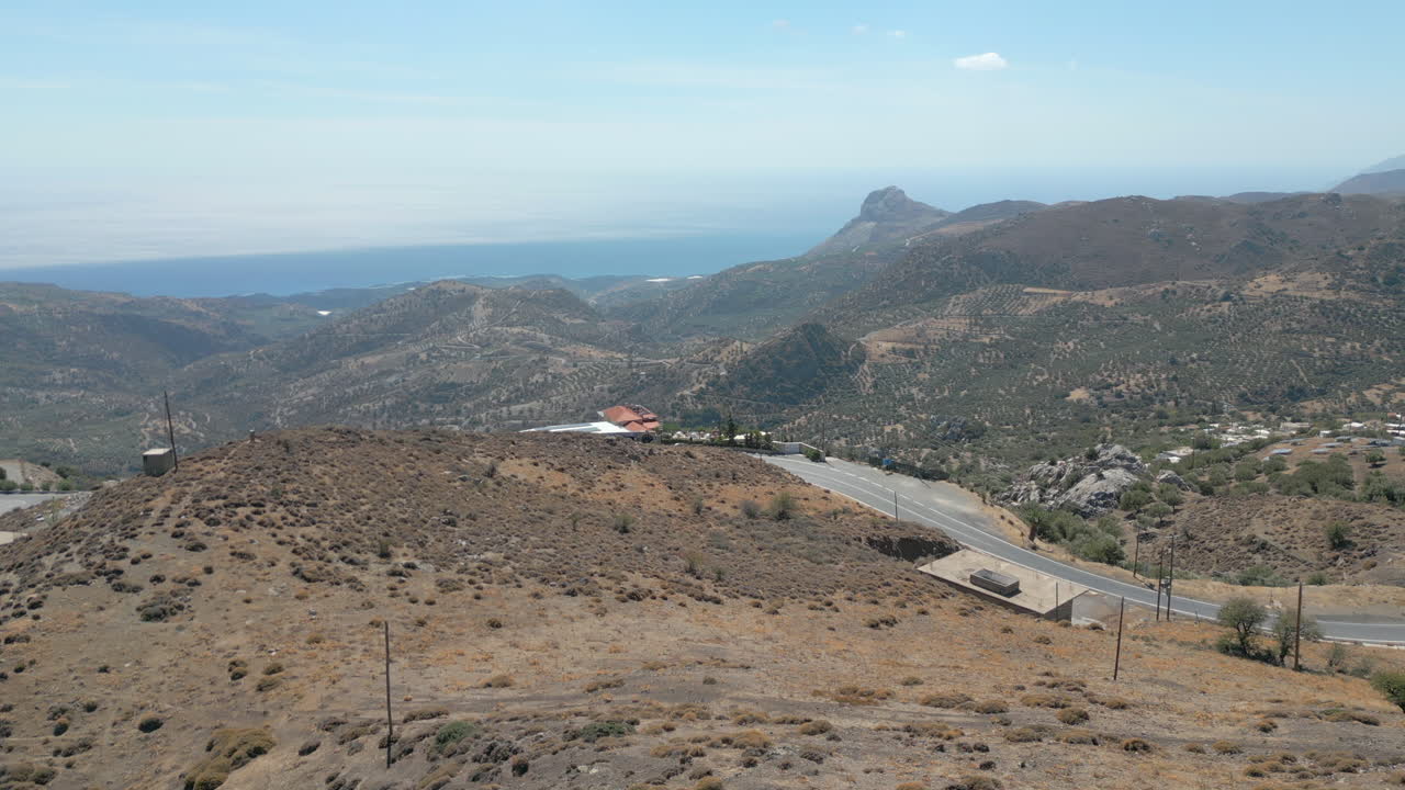 Church Looks Out Over Crete Coastline In Greece Drone Track Back 4K 60FPS