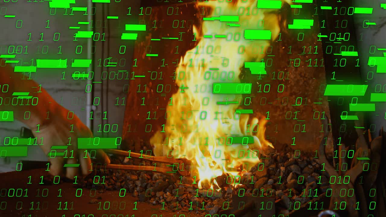 Smith using tongs placing metal into coals, causing flame, green overlay covering fire for forging