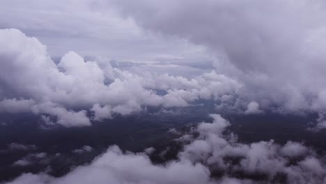 drone shot of the clouds over the mountains