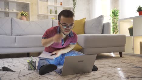 Disabled-dwarf-young-man-working-remotely-online-from-home-on-laptop.