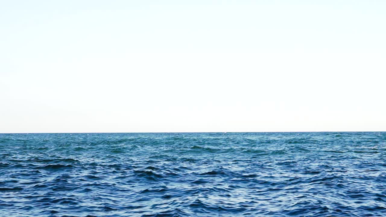 Wavy sea water surface. View of blue background of sea
