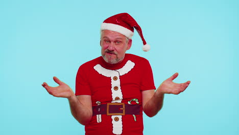 Confused-man-in-t-shirt-Santa-Christmas-hat-pointing-fingers-himself-ask-say-who-why-me-no-thanks