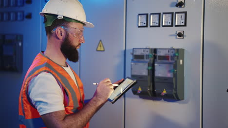 electrician inspecting electrical panel