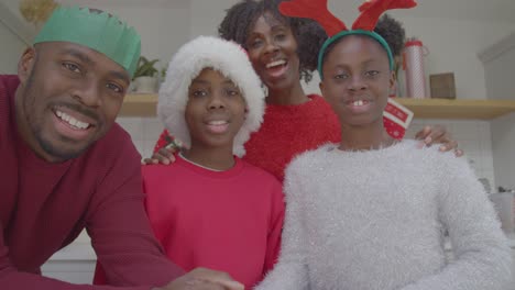 Joyful-Family-Talking-Directly-into-Webcam-During-a-Christmas-Video-Call