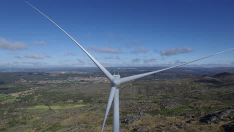 wind turbine drone shot. dolly effect zoom out. it can be inverted in post