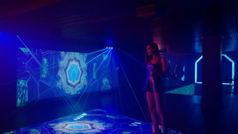 woman dancing in a futuristic neon-lit interactive digital space