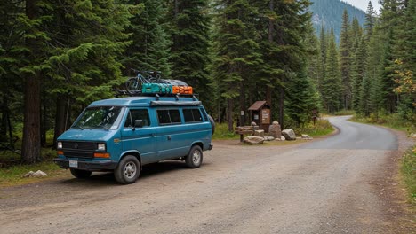 a scenic pause: vintage van steadily stationed along an enchanting forest pathway, surrounded by towering evergreens and serene mountain views