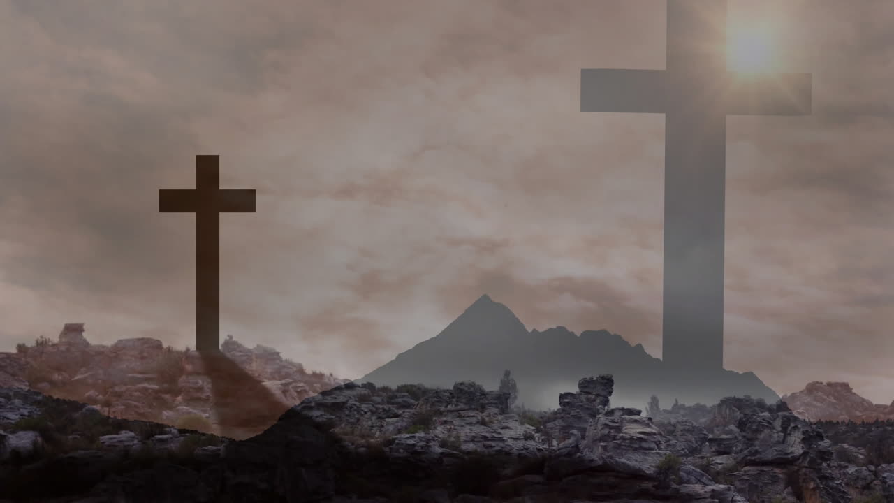 Cloudy sky over silhouetted crosses and rocky landscape creating dramatic scene