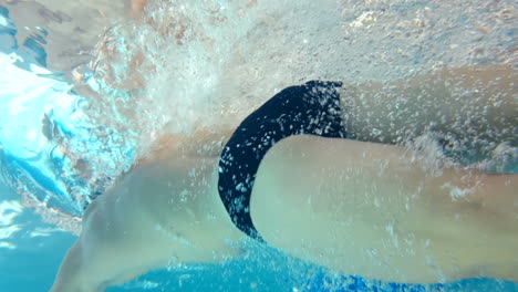 underwater view of man swimming