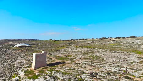 Drone-shot-over-rocks-in-nature-and-towards-a-stone-tower-3