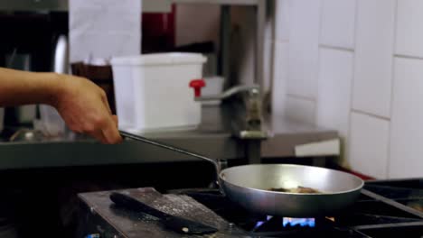 Male-baker-preparing-food-in-kitchen-4k