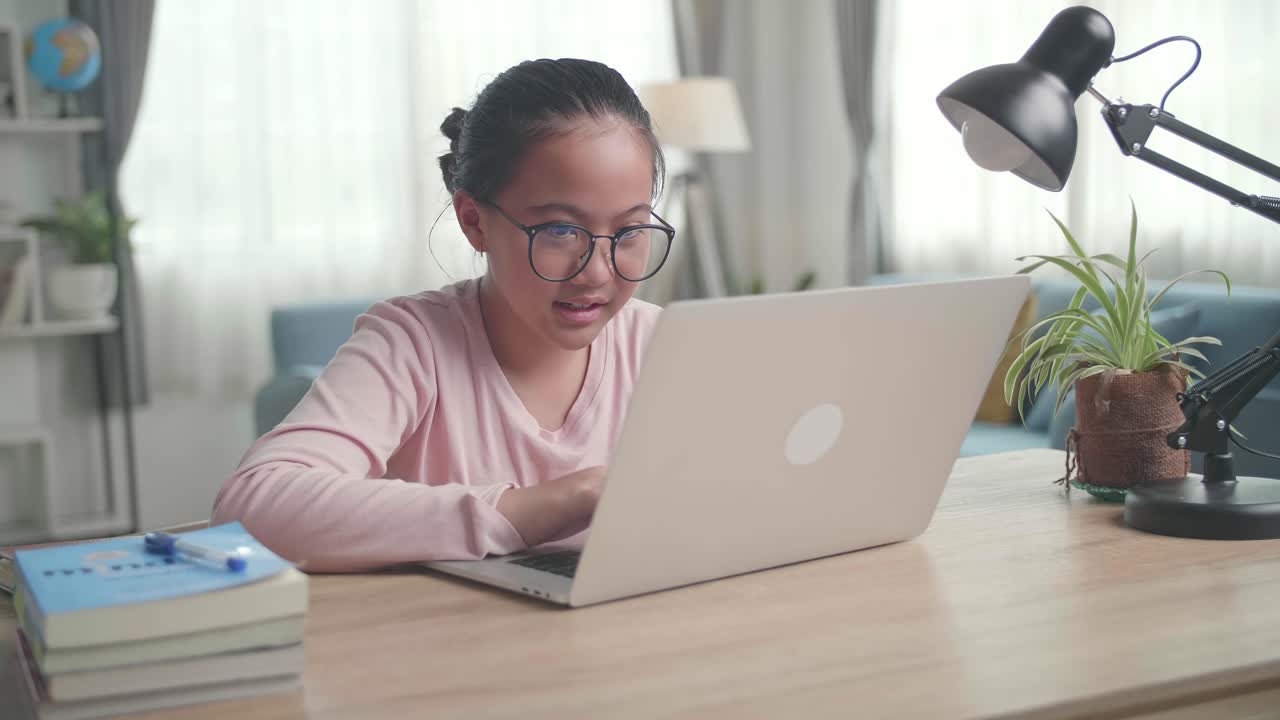Teenage Girl Use Laptop Doing Homework At Living Room