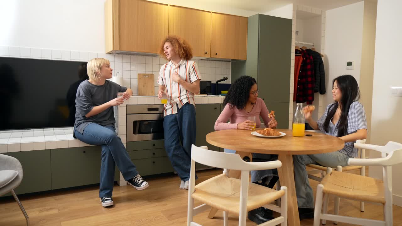 Friends Eating and Conversing in an Apartment Kitchen