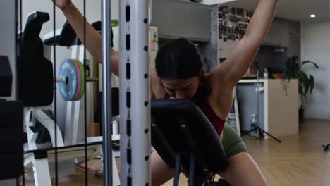 woman working out on exercise machine