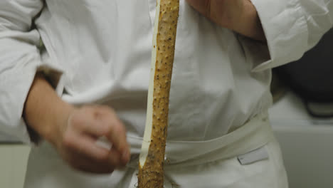 peeling radish vertically with razor sharp thin knife