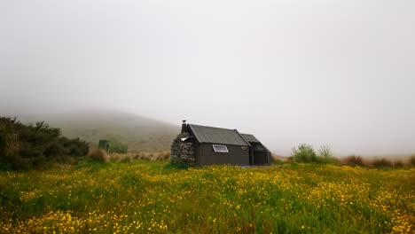 time lapse of spur hut on a misty day in spring