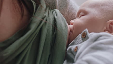 mother breastfeeding baby at home mom nursing infant nurturing child suckling milk from breast motherhood maternity care