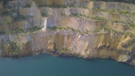 aerial view of a quarry with a lake