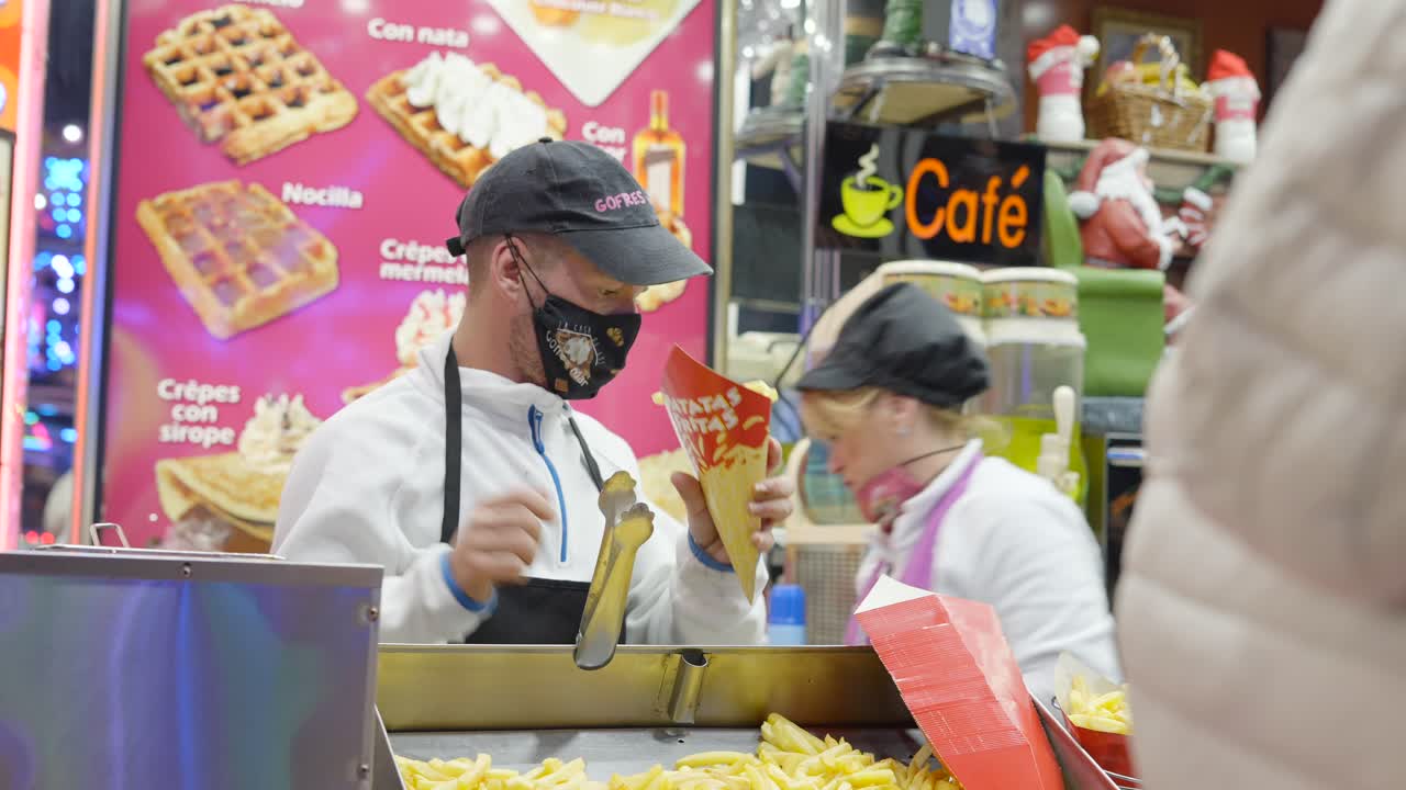 Street Food Vendor Serving French Fries