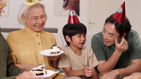 a joyful family gathering celebrating a birthday with cake, laughter, and party hats in a warm, inviting setting