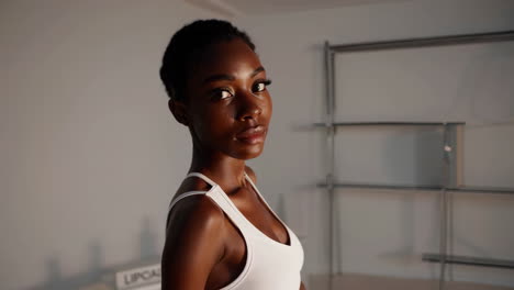 portrait of a woman in a white sports bra