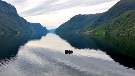serene fjord landscape with boat and passengers