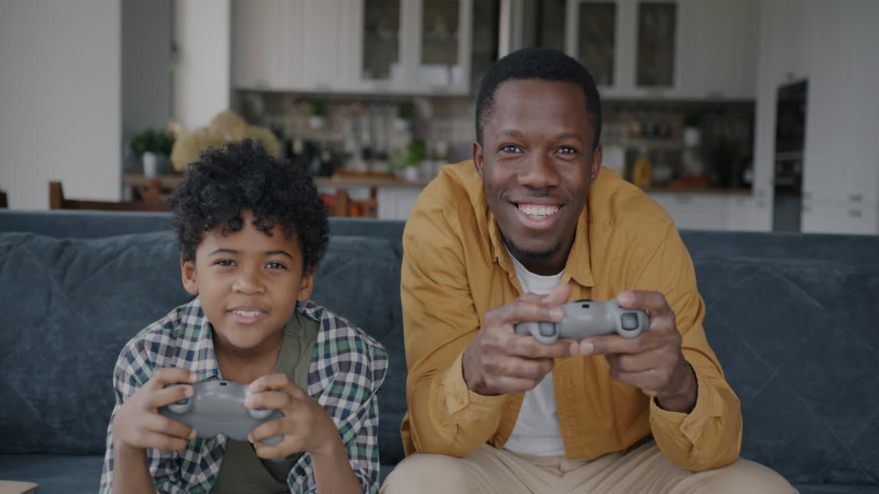 Father and Son Playing Video Games Together
