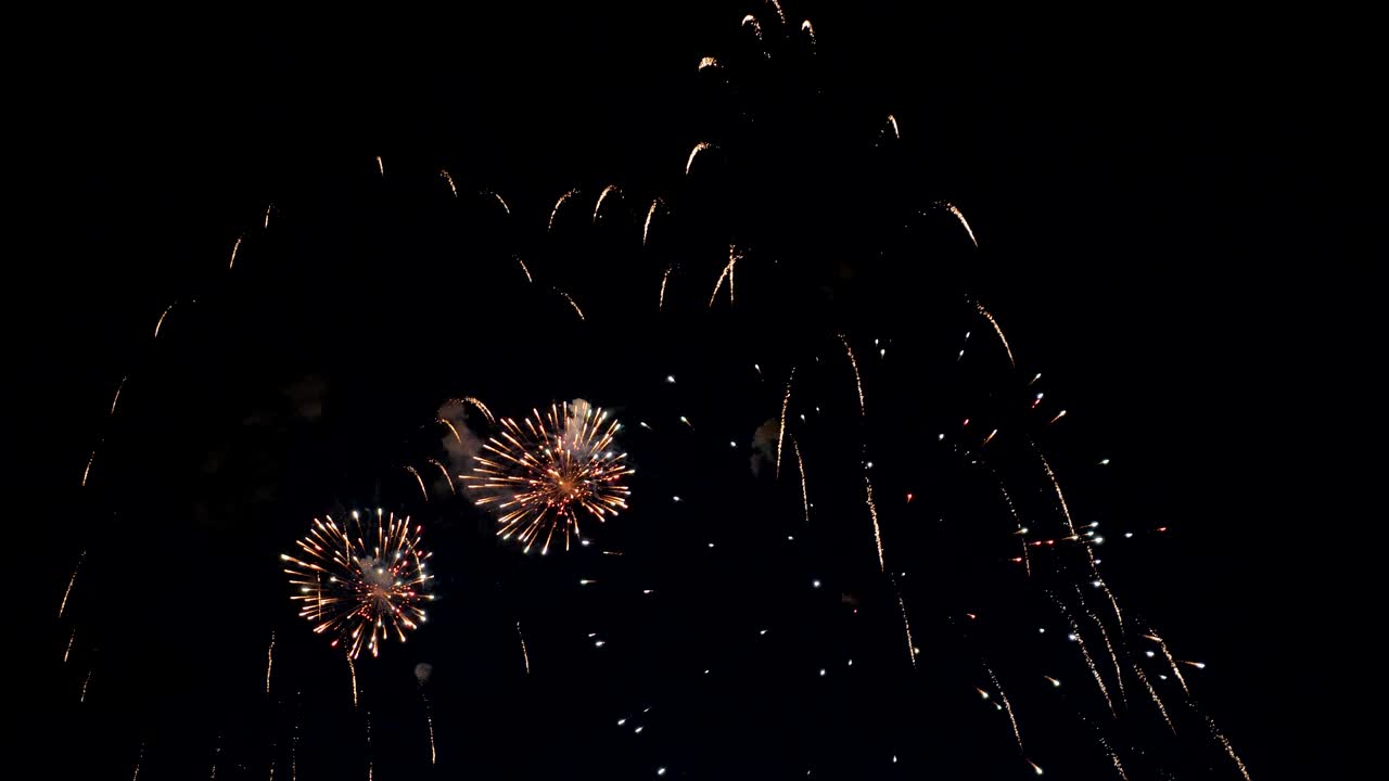 Fireworks display on dark sky background