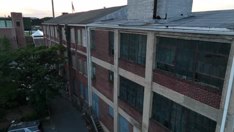 rundown warehouse building with broken windows