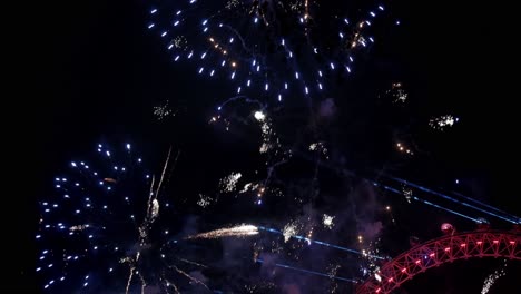 a stunning fireworks display above the london eye, symbolizing celebration and joy